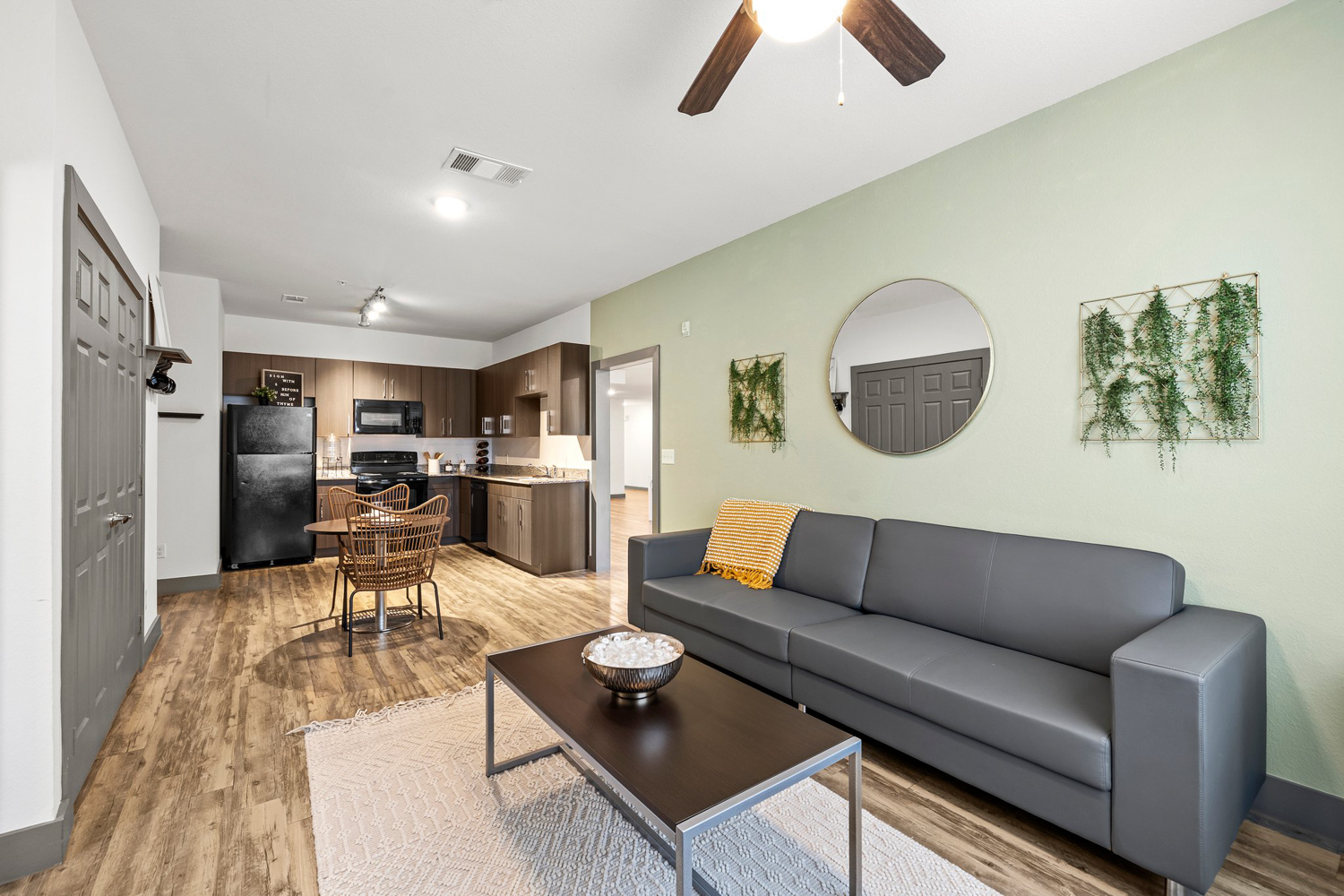 holleman crossing apartments near texas am furnished living room and kitchen