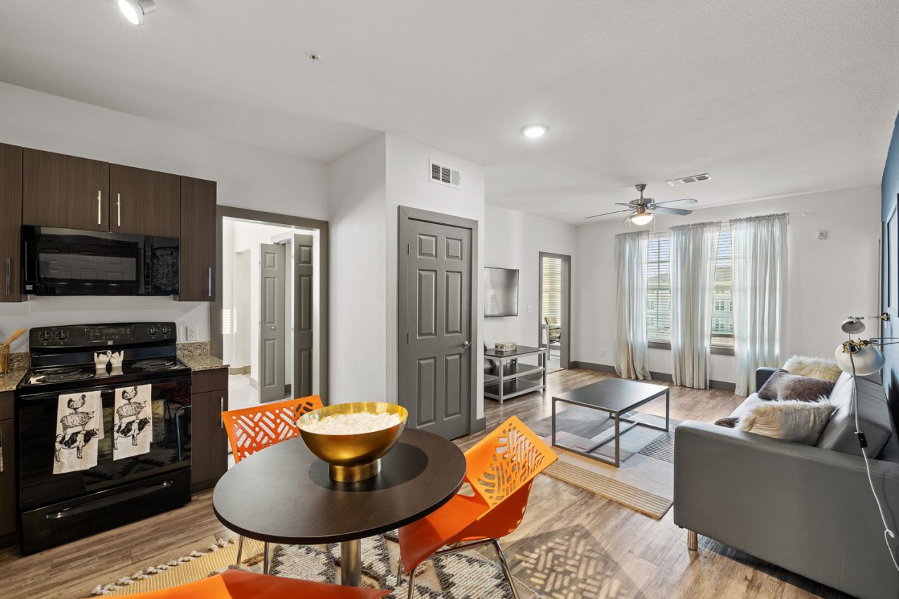 holleman crossing apartments near texas am kitchen and living room