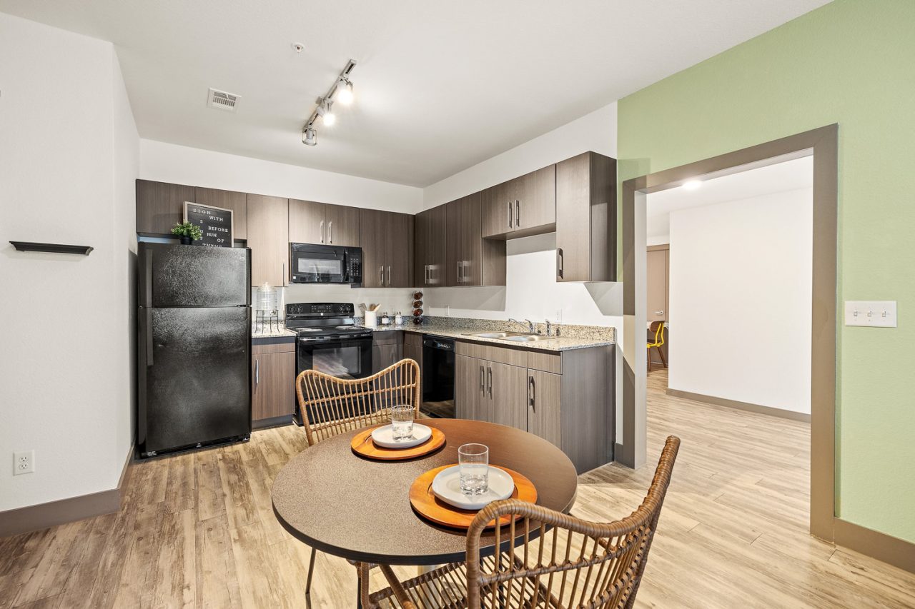 holleman crossing apartments near texas am kitchen with dining table