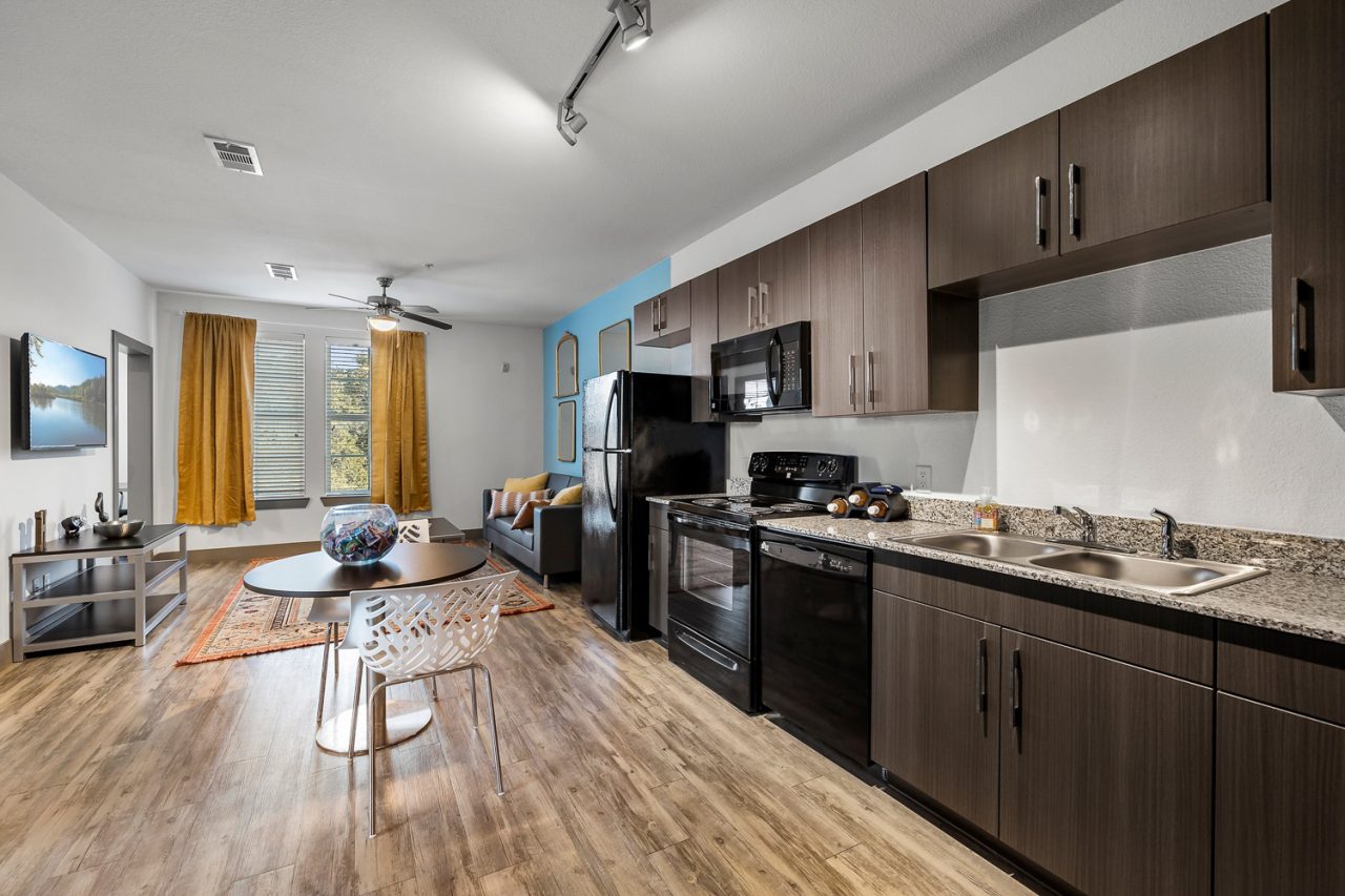 holleman crossing apartments near texas am open kitchen to living room