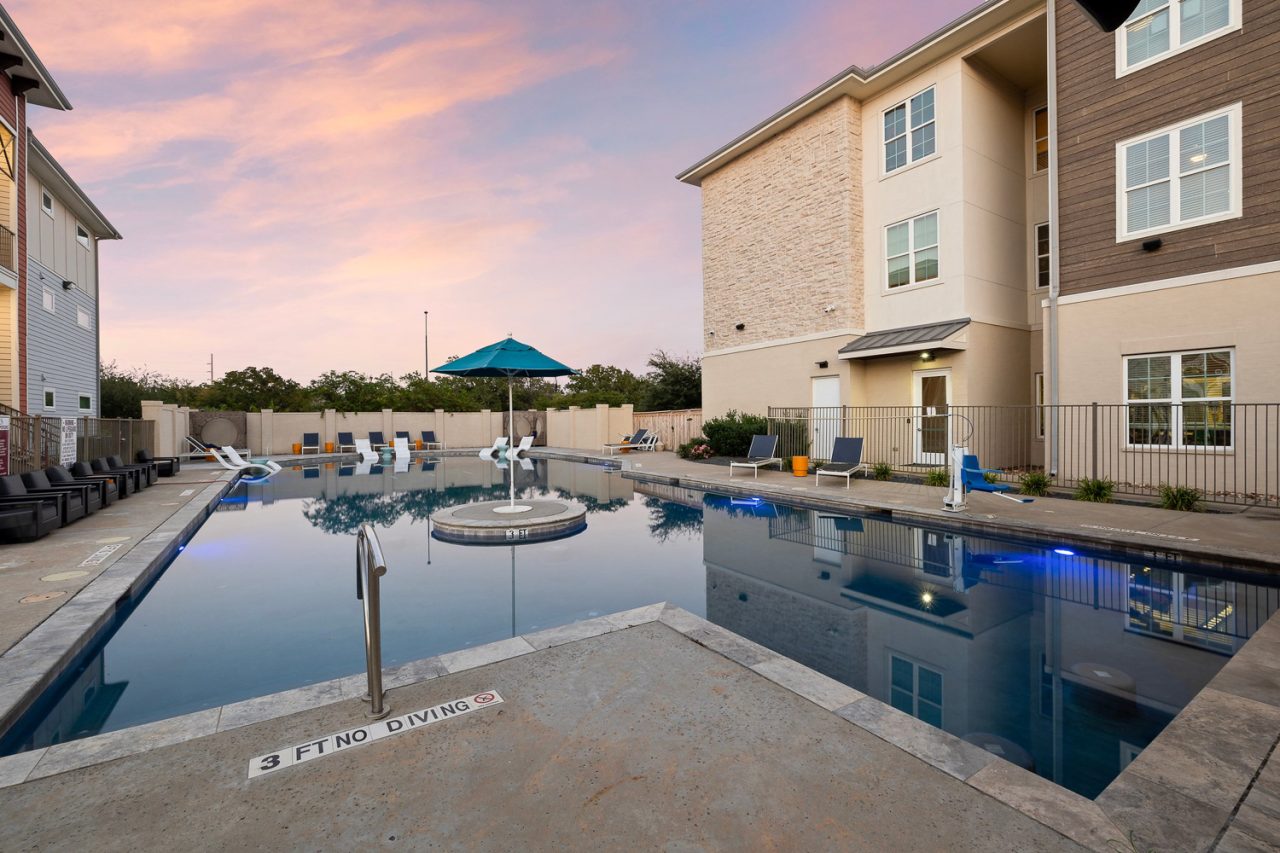 holleman crossing apartments near texas am pool at dusk